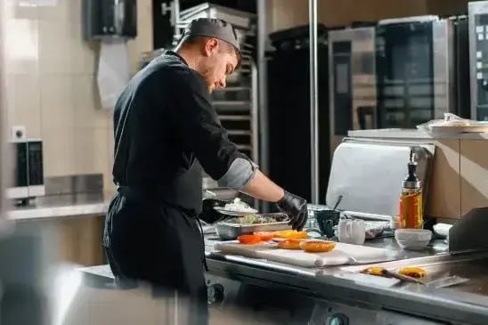 Chef preparing food in a commercial kitchen