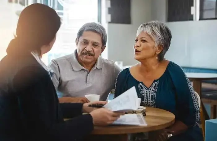Customers speaking with a restaurant server