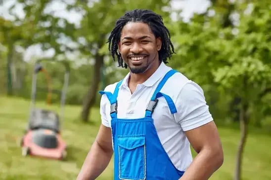 Smiling hospitality worker outdoors