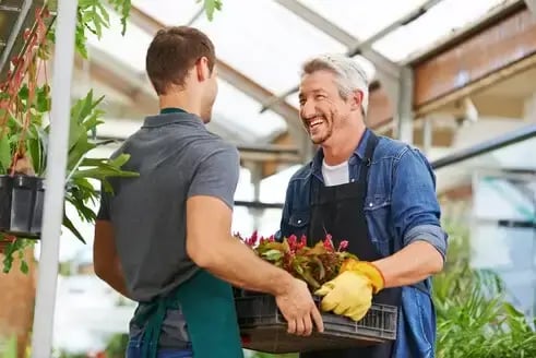Workers handling plants at a garden center-1