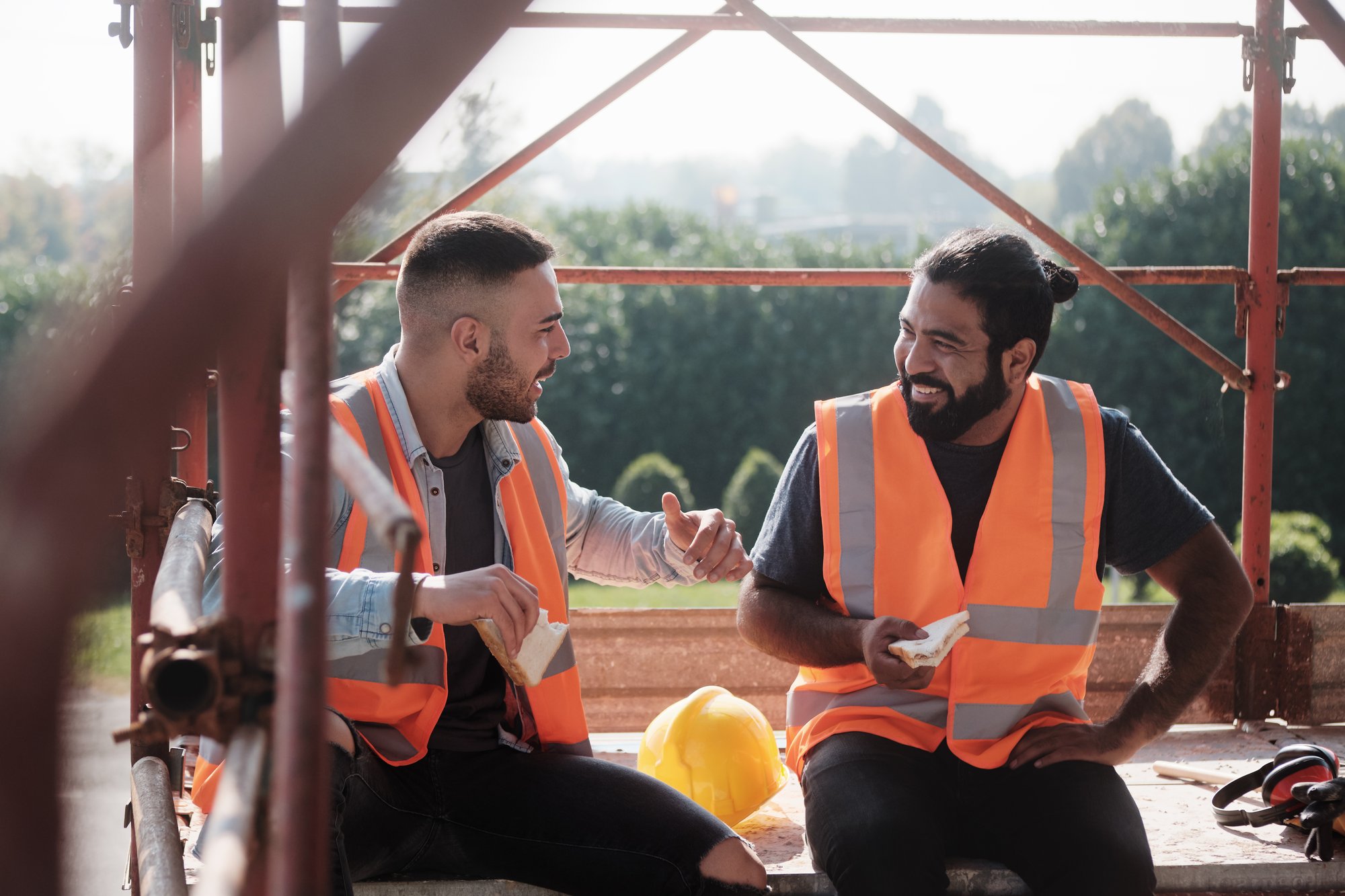 two international construction workers talking