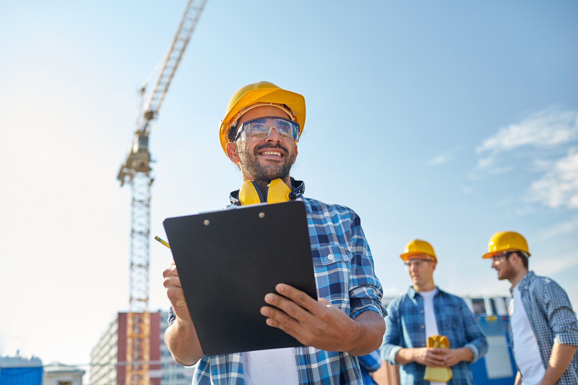 male construction worker with clipboard