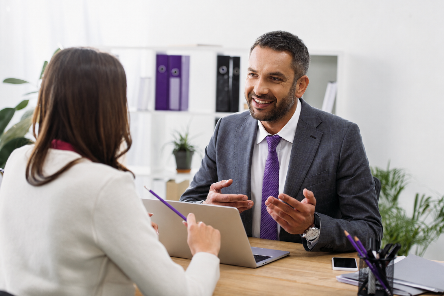 selective-focus-of-advisor-sitting-at-table-with-l-2026-01-06-00-29-19