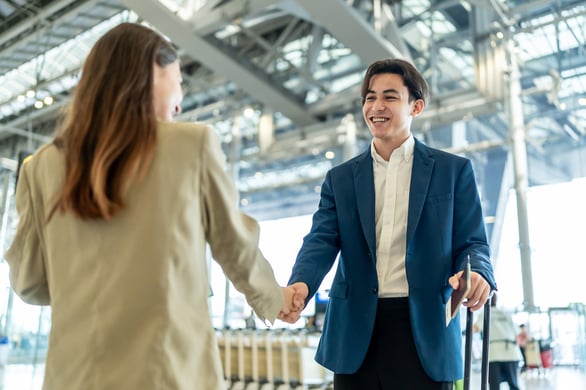 Business professionals shaking hands in an office
